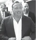  ?? Austin American-Statesman via AP ?? “Infowars” host Alex Jones arrives on April 17 at the Travis County Courthouse in Austin.