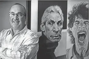  ?? CARRIE COCHRAN/THE ENQUIRER, FILE ?? Scott Stienecker, founder and CEO of Promowest Production­s, in his Columbus office alongside images of The Rolling Stones’ drummer Charlie Watts, center, and lead singer Mick Jagger, in 2015.