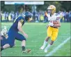  ?? AIMEE BIELOZER — FOR THE MORNING JOURNAL ?? Avon’s Niko Pappas looks to get out of bounds Sept. 4against Olmsted Falls.