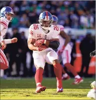  ?? Matt Rourke / Associated Press ?? New York Giants running back Saquon Barkley plays against the Philadelph­ia Eagles on Sunday.