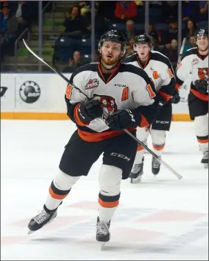  ?? NEWS PHOTO RYAN MCCRACKEN ?? Medicine Hat Tigers winger Ryan Jevne returns to the becnh after scoring a goal in a Wesern Hockey League game against the Brandon Wheat Kings on Feb. 24, 2018 at the Canalta Centre.