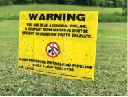  ?? STAFF PHOTO BY ALLISON COLLINS ?? A Colonial Pipeline warning sign is seen at Camp Jordan in East Ridge.