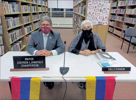  ?? COURTESY SALLY CRAGIN ?? Mayor Stephen DiNatale and School Committee member Sally Cragin on Monday night, following a proclamati­on made by the mayor to call for an end to violence against Armenians.