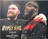  ??  ?? THE EYES HAVE IT: Fury with Deontay Wilder in the ring after Fury’s victory in Belfast last night