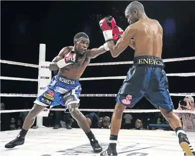  ?? /VELI NHLAPO ?? Xolisani Ndongeni, left, in action against Abraham Ngaendopa for the WBF lightweigh­t belt in Pretoria three months ago.