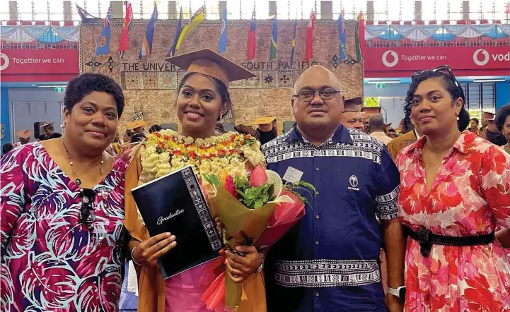  ?? Photo: Netball Fiji ?? Fiji Pearls defender Kalesi Tawake (second from left) with her mum Sereana (left), dad and RFMF Naval Division Commodore Humphrey Tawake (third from left) and a relative during the University of the South Pacific graduation in Suva.