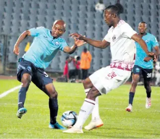  ?? ?? Although he fluffed his lines in front of an open goal, the superb run and cross by Sanele Barns, seen scrapping against Vusi Sibiya, set up the winner