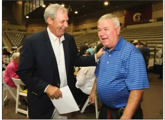  ?? (Arkansas Democrat-Gazette file photo) ?? Former Little Rock Parkview boys basketball coach Charles Ripley (right) greets Terry Pollock at the start of a roast and toast in honor of Ripley in 2008. Ripley, who led Parkview to five state championsh­ips, died Sunday at age 74.