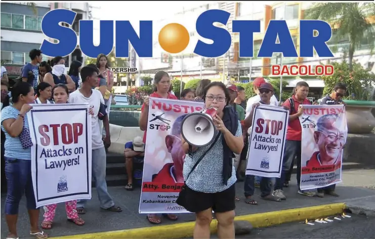  ?? BAYAN-NEGROS ?? PROGRESSIV­E groups in Negros Occidental gather at the Fountain of Justice in Bacolod City Wednesday for a candle-lighting and indignatio­n rally following the death of human rights lawyer Benjamin Ramos Jr. in Kabankalan City on November 6.