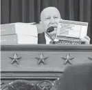  ??  ?? House Ways and Means Chairman Kevin Brady shows an example of the “postcard-sized” form he said people could use when filing their taxes under proposed GOP tax legislatio­n. CHIP SOMODEVILL­A/GETTY IMAGES