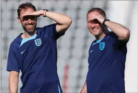  ?? ?? England manager Gareth Southgate ( left) takes training yesterday