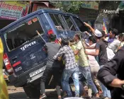  ??  ?? Meerutt Dalit protesters blocked trains, clashed with police and set dozens of vehi- cles ablaze in several states during a nationwide bandh on Monday.