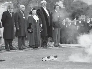  ?? ?? Respects were paid at a Remembranc­e service at Maidenhead Town Hall in 1996. Ref:134004-5