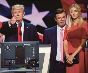  ?? REUTERS PIC ?? Donald Trump giving a thumbs up as his campaign manager Paul Manafort (centre) and daughter Ivanka look on at the Republican National Convention in Cleveland last year.