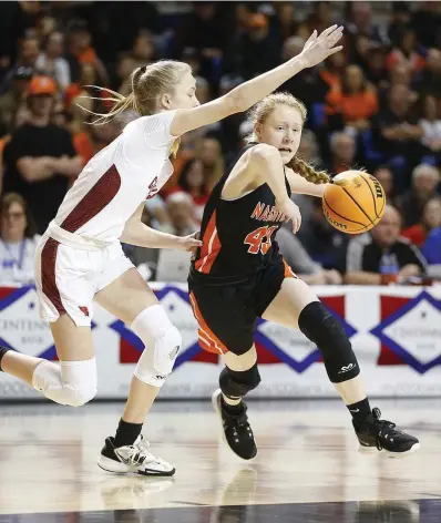  ?? (Arkansas Democrat-gazette/thomas Metthe) ?? Nashville’s Shalyn Lyle (43) drives to the basket while guarded by Farmington’s Marin Adams (2) during the second quarter of the Farmington’s 65-61 win in the Class 4A girls state championsh­ip game on Thursday at Bank OZK Arena in Hot Springs. More photos at www.arkansason­line.com/310girls4a/