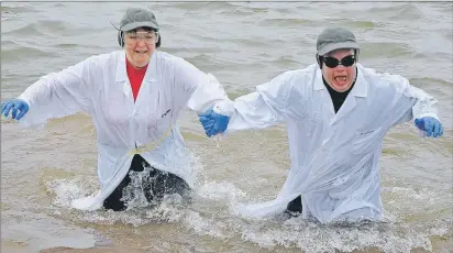  ?? ANCELENE MACKINNON/JOURNAL PIONEER ?? Janet Bradshaw, coach of track and field for Summerside, and Paul Phillips with Prince County Special Olympics, run out of the Summerside harbour, while taking part in the fourth annual Law Enforcemen­t Torch Run event on Sunday afternoon.