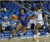  ?? ASHLEY LANDIS — THE ASSOCIATED PRESS ?? UCR’S Jordan Webster (32) drives against UCLA’S Charisma Osborne during a game in November.