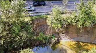  ?? TY GREENLEES / STAFF ?? The south bank of Little Twin Creek dives nearly 30 feet down from Manning Road, which is threatened by continued erosion. Montgomery County will spend more than $800,000 to realign and stabilize the creek. “We don’t have a choice,” said senior county engineer Joseph Dura.