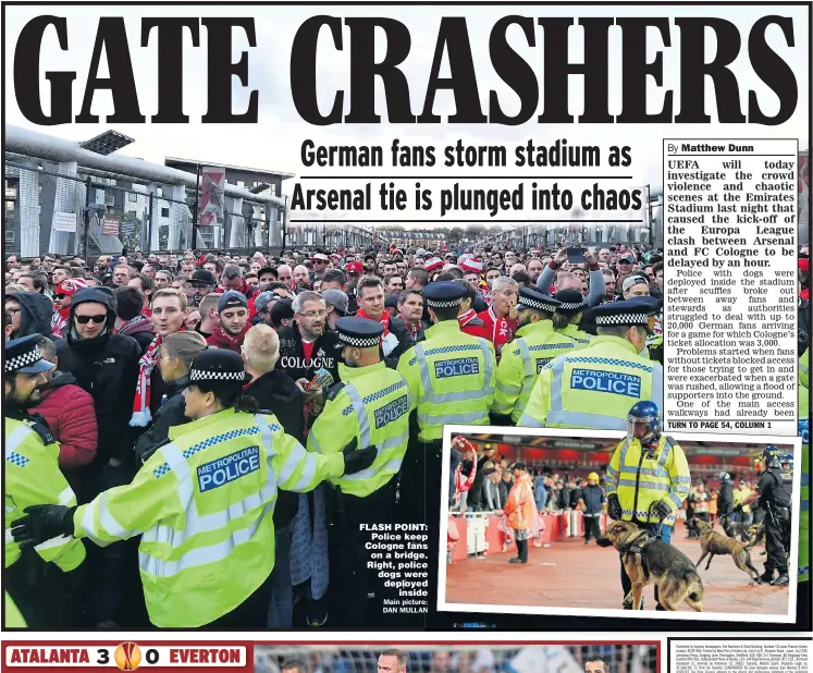  ?? Main picture: DAN MULLAN ?? FLASH POINT: Police keep Cologne fans on a bridge. Right, police dogs were deployed inside
