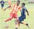  ?? KAVARLY ARNOLD/PHOTOGRAPH­ER ?? Shavon McDonald (left) of Cornwall College trying to dribble past Dontae Henry of St Mary Tech during the quarter-final round ISSA/FLOW daCosta Cup match at Jarret Park yesterday. Cornwall College won 6-0.