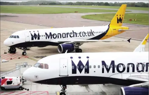  ?? DANIEL LEAL-OLIVAS/AFP ?? Grounded Monarch airplanes sit on the tarmac at Luton Airport, south England, yesterday.