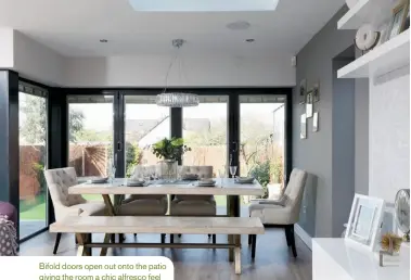  ??  ?? Bifold doors open out onto the patio giving the room a chic alfresco feel