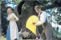  ?? Clive Coote Miramax Films ?? “FINDING NEVERLAND” Kate Winslet and Johnny Depp in Kensington Gardens play out the fateful meeting of J.M. Barrie and Sylvia Llewelyn Davies.