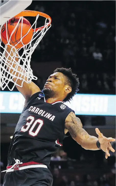  ?? — GETTY IMAGES ?? South Carolina Gamecocks forward Chris Silva dunks the ball in the second half against the Duke Blue Devils on Sunday in Greenville, S.C. Silva had 17 points and 10 rebounds in the 88-81 win.