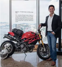  ??  ?? TV AND RADIO HOST DOMINIC LAU with his Ducati and Tumi backpack