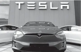  ?? AFP-Yonhap ?? A showroom and service center for the U.S. automotive and energy company Tesla is seen in Amsterdam in this 2019 file photo.