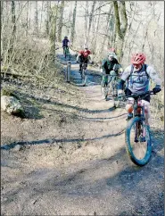  ?? (File Photo/NWA Democrat-Gazette) ?? Mountain bikers enjoy the ride on one of Bella Vista’s trails.