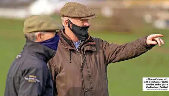  ?? Alan Crowhurst/Getty Images ?? > Simon Claisse, left, with Irish trainer Willie Mullins at this year’s Cheltenham Festival