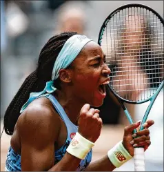  ?? THIBAULT CAMUS/ASSOCIATED PRESS ?? Coco Gauff of the U.S. celebrates as she defeats Belgium’s Elise Mertens 6-4, 6-0 in their fourth-round match Sunday at the French Open in Roland Garros stadium in Paris.