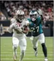  ?? SCOTT THRELKELD — ASSOCIATED PRESS ?? Saints running back Alvin Kamara, left, beats Eagles safety Malcolm Jenkins for a late touchdown Sunday at the Mercedes-Benz Superdome in New Orleans. Jenkins followed up that play with a hand-gesture message to his old coach, Sean Payton.