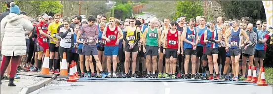  ?? FM28210106 ?? Athletes check their watches just before the start of the Ashford & District 10k