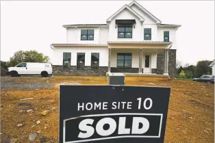  ?? MATT ROURKE/ASSOCIATED PRESS FILE PHOTO ?? A home under constructi­on marked as “SOLD” at a developmen­t in Eagleville, Pa., last year. The United States is slogging through a housing affordabil­ity crisis that was decades in the making. The shortage pours cold water on President Joe Biden’s assurances that the U.S. economy is strong.