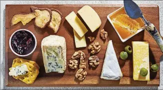  ?? STACY ZARIN GOLDBERG FOR THE WASHINGTON POST PHOTOS ?? Start with your favorites and fill in from there. On this board, clockwise from top left: dried pears, havarti, honey with honeycomb, English cheddar, olives, Camembert, walnuts, Castello Creamy Blue, crackers and currant jam.