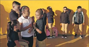  ?? Al Seib Los Angeles Times ?? STUDENTS returned to L.A. Unified schools like Dolores Huerta Elementary on Tuesday, many to classrooms with malfunctio­ning HVAC systems. Experts say high temperatur­es can hurt children’s ability to learn.