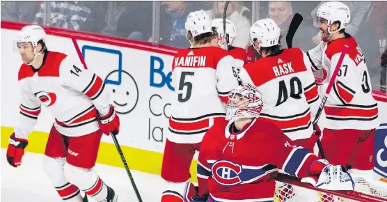  ?? THE CANADIAN PRESS ?? Canadiens goalie Carey Price looks up after surrenderi­ng a goal to the Hurricanes on Thursday night. Price has won just one of his last five starts at the Bell Centre. He used to be able to cover up for many of his teammates’ mistakes, but that’s no...