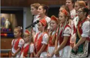  ?? ERIC BONZAR—THE MORNING JOURNAL ?? Members of the Lorain Hungarian Folklore Group perform during the 41st annual Heritage of Sacred Music Concert, June 20. The concert, held at St. Peter Parish, 3655 Oberlin Ave, Lorain, was presented by the Lorain Internatio­nal Associatio­n.