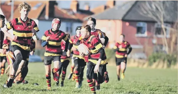  ??  ?? Jack Thornton on the ball with Caleb Lowes and Archie Elwell in support