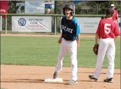  ?? NEWS PHOTO RYAN MCCRACKEN ?? White Rock All Stars catcher Matleo Manzi fires up his dugout after hitting a 2-RBI double against the Lethbridge Southwest All Stars in Friday's Canadian Little League Championsh­ip semifinal at Lovell McDonnell Field.