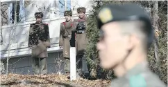  ?? LEE JIN- MAN / THE ASSOCIATED PRESS ?? North Korean soldiers in the Demilitari­zed Zone.