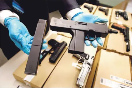 ?? CHARLA JONES/TORONTO STAR ?? Gang database played an important role in the dismantlin­g of the Ardwick Blood Crew in Rexdale. This MAC 10 was seized during one raid.