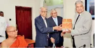  ?? PIC BY PRADEEP PATHIRANA ?? Professor Chandra Wickramage presents a copy of the latest volume of Mahawansa to Prime Minister Ranil Wickremesi­nghe.