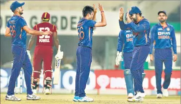  ?? ?? India’s debutant leg-spinner Ravi Bishnoi (C) celebrates the wicket of Rovman Powell during the first T20I at the Eden Gardens.