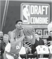  ?? CHARLES REX ARBOGAST/AP ?? Devin Robinson, from UF, worked out Thursday at the NBA draft combine in Chicago.