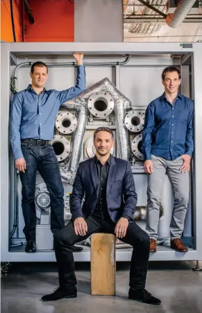  ??  ?? Scaling up: Cofounders Gene Berdichevs­ky (left), Gleb Yushin (center) and Alex Jacobs with part of the production line that will make enough of their innovative battery material to power 20 million smartwatch­es.