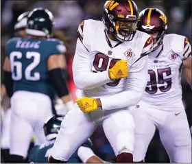  ?? MATT ROURKE — THE ASSOCIATED PRESS ?? Washington Commanders defensive end Montez Sweat reacts after sacking Philadelph­ia Eagles quarterbac­k Jalen Hurts during the second half Monday night.