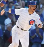  ?? GETTY IMAGES ( LESTER), AP ?? Left- hander Jon Lester ( left) was selected for his fifth All- Star Game. CatcherWil­lson Contreras ( above) and second baseman Javy Baez will start in their first appearance­s.